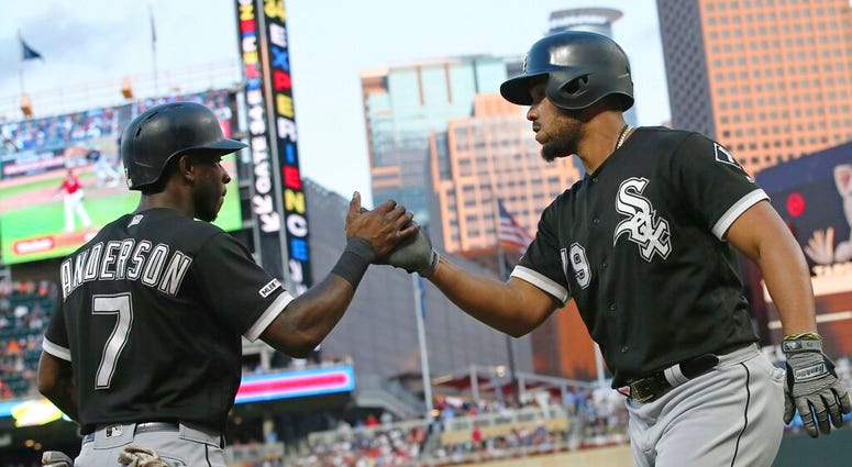 Chicago White Sox's Tim Anderson, left, congratulates Jose Abreu on Abreu's two-run home run off Minnesota Twins pitcher Michael Pineda in the third inning of a baseball game Tuesday, Aug. 20, 2019, in Minneapolis Chicago White Sox's Tim Anderson, left, congratulates Jose Abreu on Abreu's two-run home run off Minnesota Twins pitcher Michael Pineda in the third inning of a baseball game Tuesday, Aug. 20, 2019, in Minneapolis