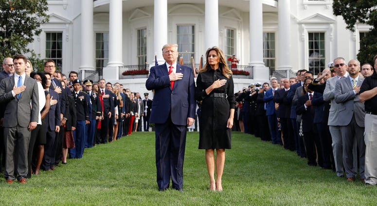 President Donald Trump and first lady Melania Trump participate in a moment of silence honoring the victims of the Sept. 11 terrorist attacks, on the South Lawn of the White House, Wednesday, Sept. 11, 2019, in Washington. President Donald Trump and first lady Melania Trump participate in a moment of silence honoring the victims of the Sept. 11 terrorist attacks, on the South Lawn of the White House, Wednesday, Sept. 11, 2019, in Washington.