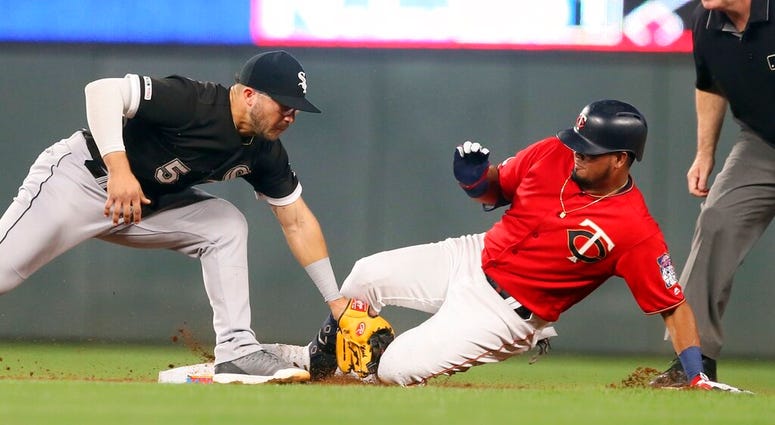 Minnesota Twins' Luis Arraez, right, beats the tag by Chicago White Sox second baseman Yolmer Sanchez to double in the third inning of a baseball game Tuesday, Sept. 17, 2019, in Minneapolis. Minnesota Twins' Luis Arraez, right, beats the tag by Chicago White Sox second baseman Yolmer Sanchez to double in the third inning of a baseball game Tuesday, Sept. 17, 2019, in Minneapolis.