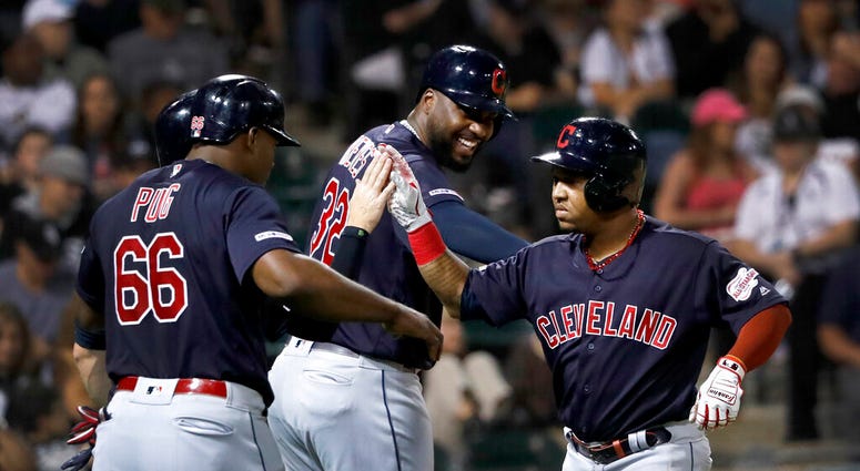 Cleveland Indians Jose Ramirez, right, celebrates with Yasiel Puig (66) and Franmil Reyes after Ramirez's three-run home run off Chicago White Sox's Hector Santiago during the third inning of a baseball game Tuesday, Sept. 24, 2019, in Chicago. Cleveland Indians Jose Ramirez, right, celebrates with Yasiel Puig (66) and Franmil Reyes after Ramirez's three-run home run off Chicago White Sox's Hector Santiago during the third inning of a baseball game Tuesday, Sept. 24, 2019, in Chicago.