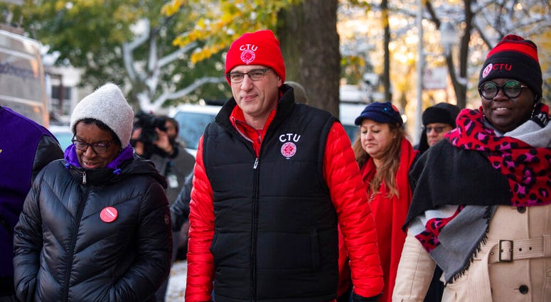 Chicago Teachers Union and Service Employees International Union members walk to Richard Yates Elementary School together after a teachers strike that lasted more than two weeks, Friday morning, Nov. 1, 2019. Chicago Teachers Union and Service Employees International Union members walk to Richard Yates Elementary School together after a teachers strike that lasted more than two weeks, Friday morning, Nov. 1, 2019.