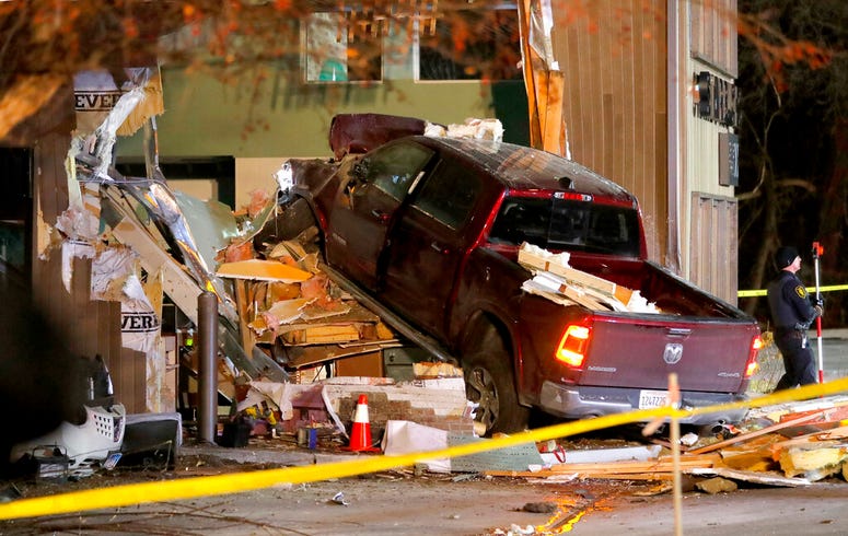 Personnel work at the scene in McHenry, Ill. where a vehicle drove into the Starbucks Thursday, Jan. 16, 2020. Personnel work at the scene in McHenry, Ill. where a vehicle drove into the Starbucks Thursday, Jan. 16, 2020.