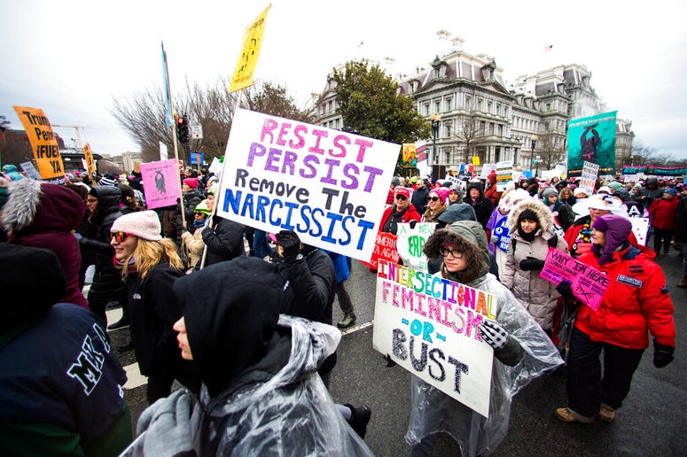 Participants take part in the Women's March near the White House, Saturday, Jan. 18, 2020, in Washington.