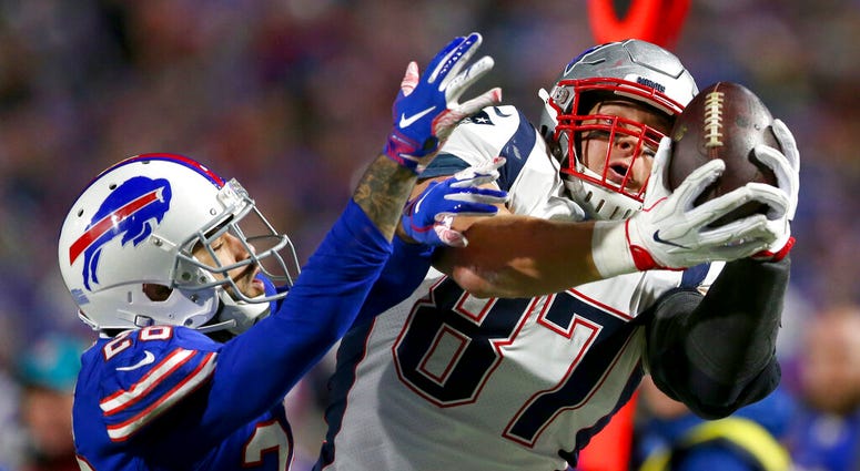 New England Patriots tight end Rob Gronkowski, right, makes a catch next to Buffalo Bills defensive back Phillip Gaines during the second half of an NFL football game in Orchard Park, N.Y. New England Patriots tight end Rob Gronkowski, right, makes a catch next to Buffalo Bills defensive back Phillip Gaines during the second half of an NFL football game in Orchard Park, N.Y.
