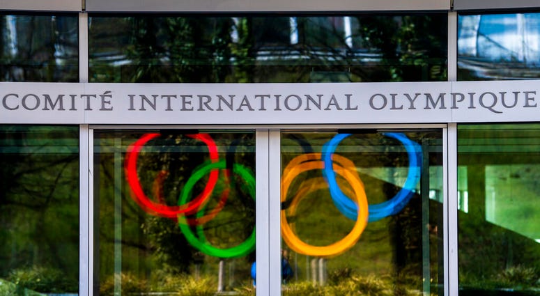 The Olympic Rings are displayed at the entrance of the IOC, International Olympic Committee headquarters during the coronavirus disease (COVID-19) outbreak in Lausanne, Switzerland, Tuesday, March 24, 2020. The Olympic Rings are displayed at the entrance of the IOC, International Olympic Committee headquarters during the coronavirus disease (COVID-19) outbreak in Lausanne, Switzerland, Tuesday, March 24, 2020.