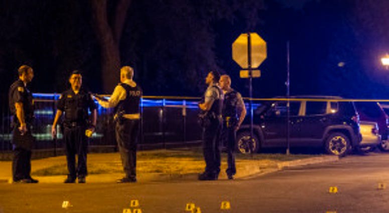 Police investigate a person shot Thursday night in the 5000 block of North Albany. Police investigate a person shot Thursday night in the 5000 block of North Albany.