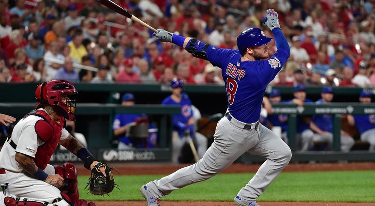 Chicago Cubs third baseman Ian Happ (8) hits a one run double off of St. Louis Cardinals relief pitcher Andrew Miller (not pictured) during the seventh inning at Busch Stadium. Chicago Cubs third baseman Ian Happ (8) hits a one run double off of St. Louis Cardinals relief pitcher Andrew Miller (not pictured) during the seventh inning at Busch Stadium.