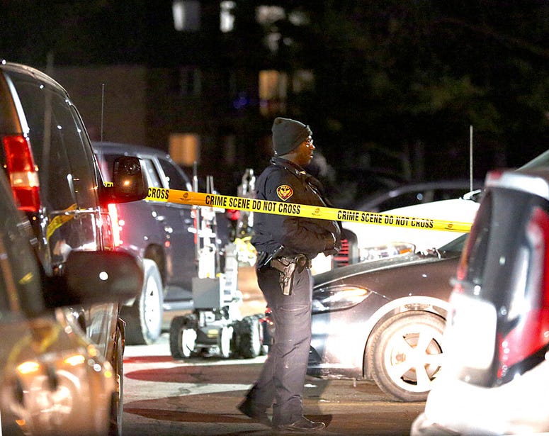 Authorities search an apartment complex Friday, Feb. 15, 2019, in Aurora, Ill., where the gunman who fatally shot several people at a manufacturing complex in the city is believed to have lived. Authorities search an apartment complex Friday, Feb. 15, 2019, in Aurora, Ill., where the gunman who fatally shot several people at a manufacturing complex in the city is believed to have lived.