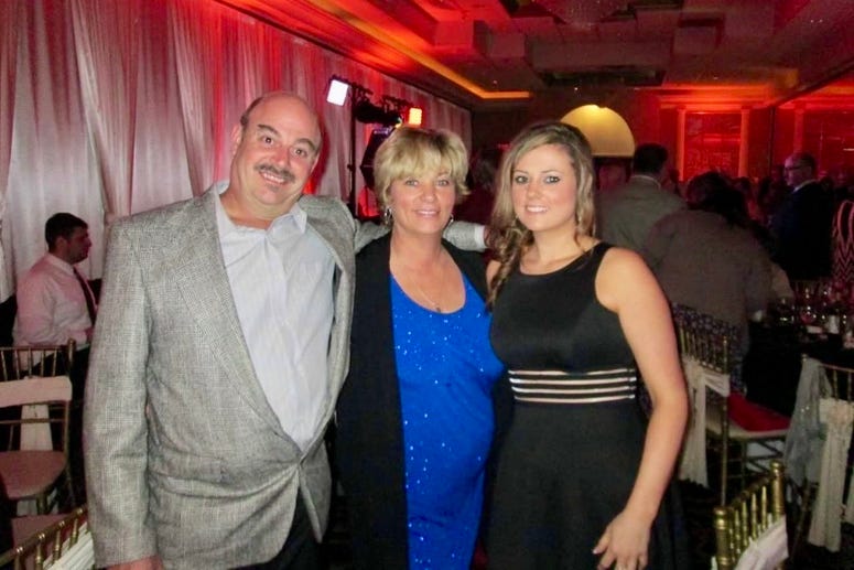 Brian Kuhns, with wife and daughter Brian Kuhns, with wife and daughter