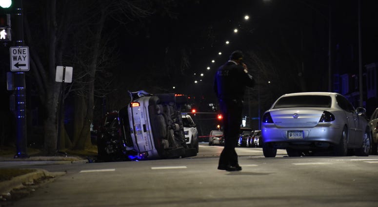 Two Chicago police officers were hurt in a rollover crash when another vehicle collided with a squad car Feb. 3, 2020, at 85th Street and Yates Boulevard. Two Chicago police officers were hurt in a rollover crash when another vehicle collided with a squad car Feb. 3, 2020, at 85th Street and Yates Boulevard.