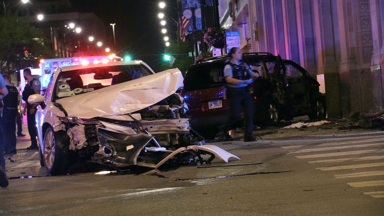Chicago police investigate the scene of a multi-vehicle crash with ejection, Thursday morning, at the intersection of Halsted and Madison, in the West Loop neighborhood. Chicago police investigate the scene of a multi-vehicle crash with ejection, Thursday morning, at the intersection of Halsted and Madison, in the West Loop neighborhood.