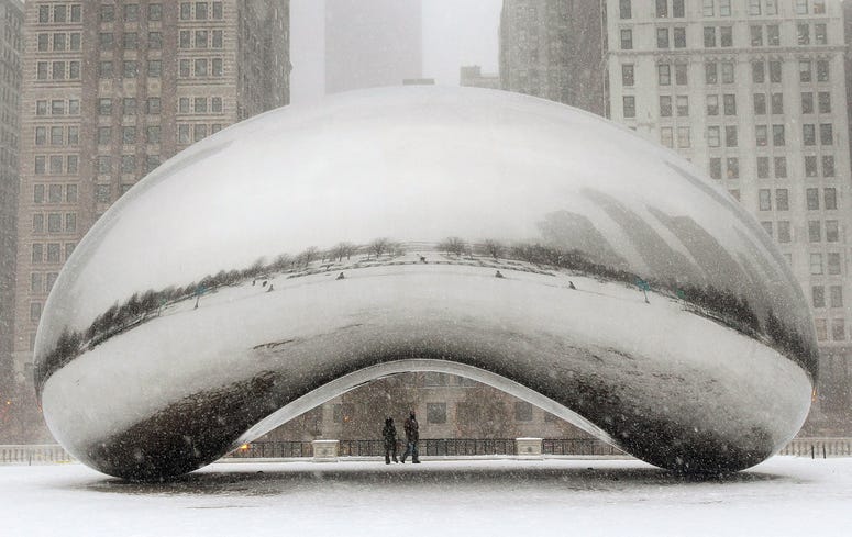 Snow falls on the Cloud Gate sculpture in Millennium Park on February 1, 2011 in Chicago Snow falls on the Cloud Gate sculpture in Millennium Park on February 1, 2011 in Chicago