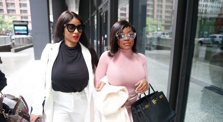 Supporters of singer R. Kelly, Azriel Clary and Joycelyn Savage, leave after the singer's arraignment at the Dirksen Federal Building on July 16, 2019 in Chicago, Illinois. Supporters of singer R. Kelly, Azriel Clary and Joycelyn Savage, leave after the singer's arraignment at the Dirksen Federal Building on July 16, 2019 in Chicago, Illinois.