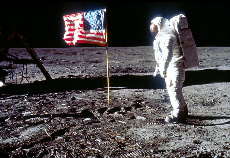 Astronaut Edwin "Buzz" Aldrin poses next to the U.S. flag July 20, 1969 on the moon during the Apollo 11 mission. Astronaut Edwin "Buzz" Aldrin poses next to the U.S. flag July 20, 1969 on the moon during the Apollo 11 mission.