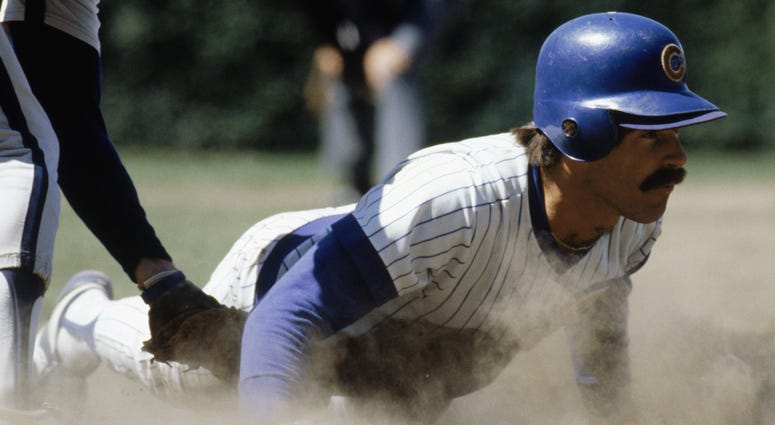CHICAGO -1980: Bill Buckner #22 of the Chicago Cubs slides across a base during a game in the 1980 season at Wrigley Field in Chicago, Illinois .