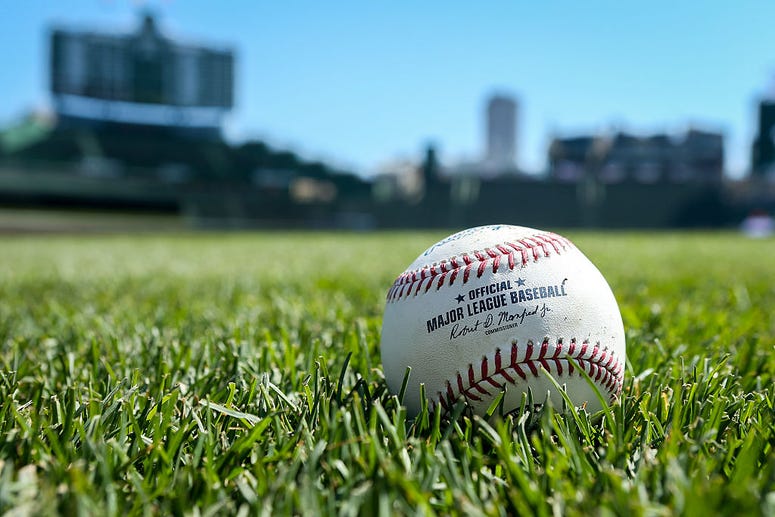 CHICAGO, ILLINOIS - APRIL 16: A baseball sits on the field before the game between the Colorado Rockies and Chicago Cubs at Wrigley Field on April 16, 2016 in Chicago, Illinois CHICAGO, ILLINOIS - APRIL 16: A baseball sits on the field before the game between the Colorado Rockies and Chicago Cubs at Wrigley Field on April 16, 2016 in Chicago, Illinois