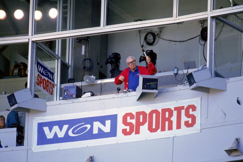 Harry Caray conducts fans singing "Take Me Out to the Ball Game" Harry Caray conducts fans singing "Take Me Out to the Ball Game"