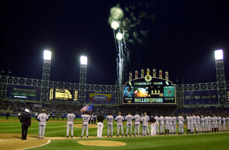 Members of the New York Yankees watch as fireworks explode over Comiskey Park before a game against the Chicago White Sox in Chicago, Illinois. Members of the New York Yankees watch as fireworks explode over Comiskey Park before a game against the Chicago White Sox in Chicago, Illinois.