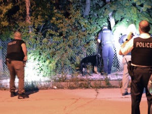 Police investigate the I-57 shooting after the white Mercedes-Benz car the shots came from was crashed and left abandoned on the expressway. Police investigate the I-57 shooting after the white Mercedes-Benz car the shots came from was crashed and left abandoned on the expressway.