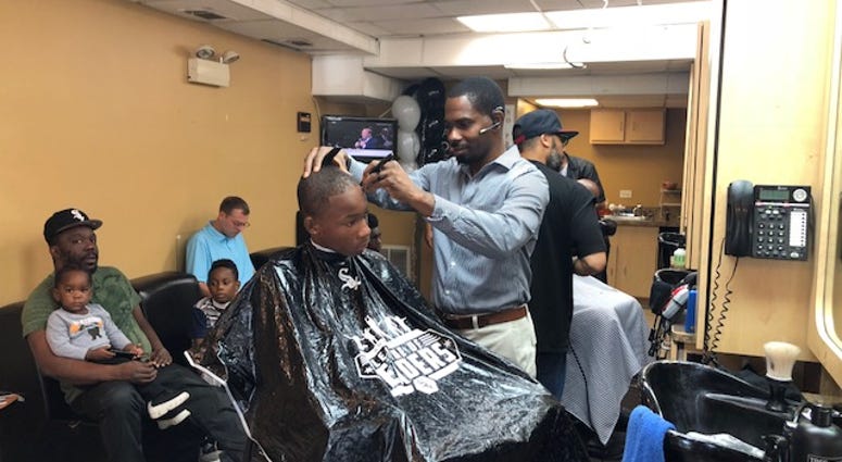 White Sox infielder Tim Anderson and his wife, Bria, host a Cuts for Kids back-to-school event to provide 100 Chicago-area kids with a free haircut and school supplies.