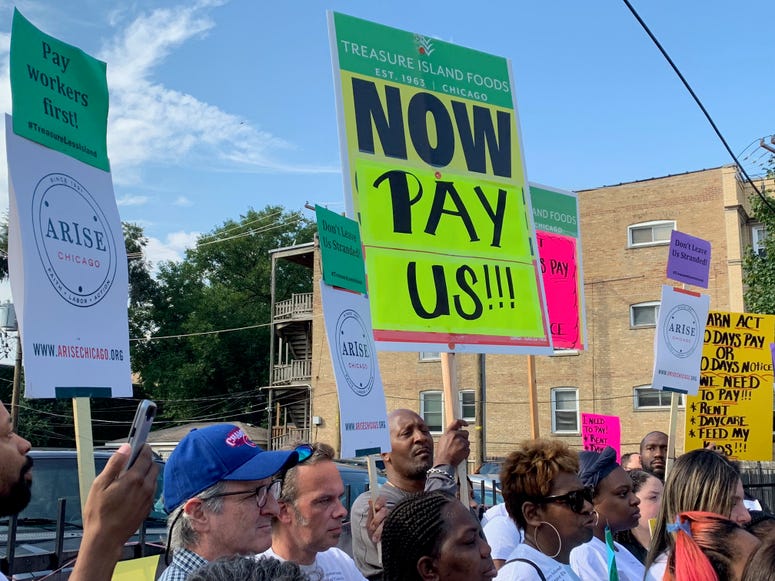 Current and former employees of Chicago's Treasure Island foods rallied outside its Lakeview store today to call on the company to pay for lost wages and insurance after its sudden closing.