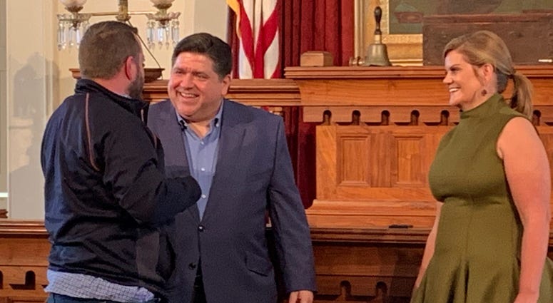 Governor-elect Pritzker and his wife M.K. greet the long line of well-wishers at the Old State Capitol in Springfield.