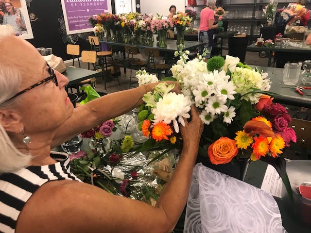 Inside a small warehouse in Evanston, dozens of volunteers, cut, fluff and bring new life to floral arrangements to be distributed to 300 hospitals, clinics and senior care facilities.