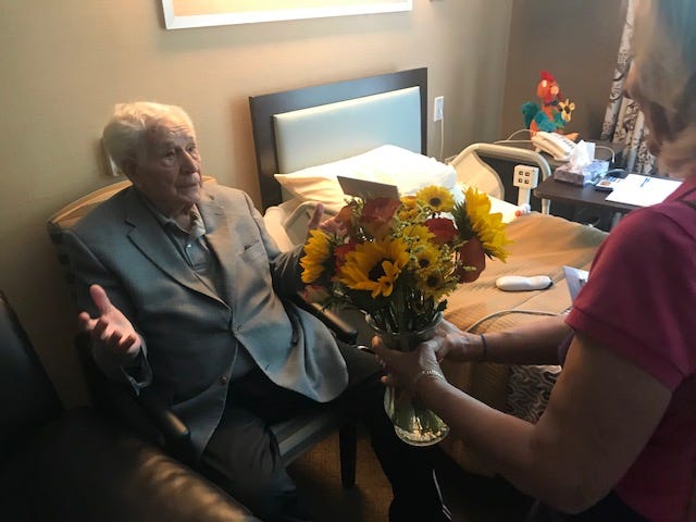 The organization serves about 500 people a week, and just delivered its 100,000th bouquet, a milestone marked by another smile.