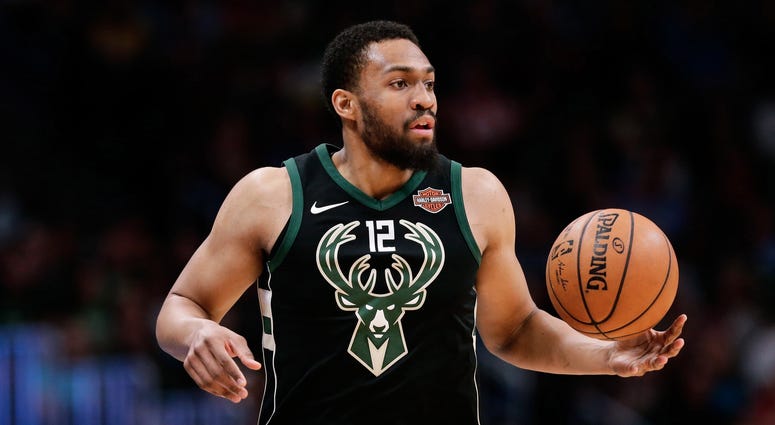 Apr 1, 2018; Denver, CO, USA; Milwaukee Bucks forward Jabari Parker (12) controls the ball in the fourth quarter against the Denver Nuggets at the Pepsi Center. Apr 1, 2018; Denver, CO, USA; Milwaukee Bucks forward Jabari Parker (12) controls the ball in the fourth quarter against the Denver Nuggets at the Pepsi Center.