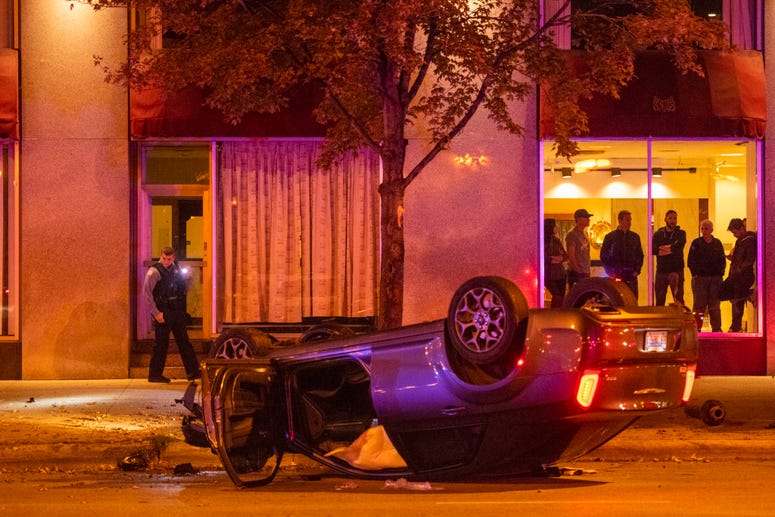 Chicago police investigate a scene where four people were shot Monday morning in the 500 block of South Michigan Avenue.