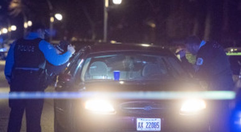 A Chicago Police officer with an assault rifle walks through a crime scene where two women were shot, Monday night in the 5400 block of West Gladys. This marks the final shooting of 2018 in Chicago. A Chicago Police officer with an assault rifle walks through a crime scene where two women were shot, Monday night in the 5400 block of West Gladys. This marks the final shooting of 2018 in Chicago.