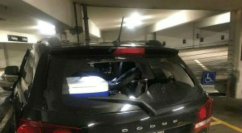 A vehicle with a broken rear windshield at a garage in the first block of East Adams Street, where 17 vehicles were damaged, Aug. 14, 2019. A vehicle with a broken rear windshield at a garage in the first block of East Adams Street, where 17 vehicles were damaged, Aug. 14, 2019.