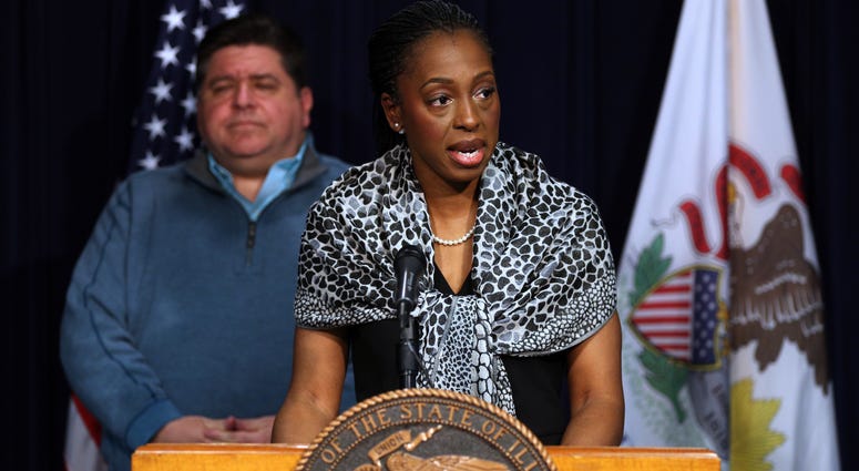 Illinois Governor J.B. Pritzker, left, and Dr. Ngozi Ezike, of the Illinois Department of Public Health