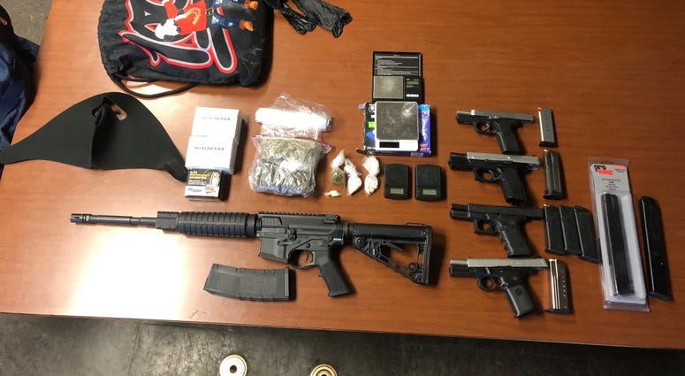 Investigators found an AR-15, four handguns, marijuana, crack cocaine, heroin and Xanax inside a south suburban Markham home on Friday.