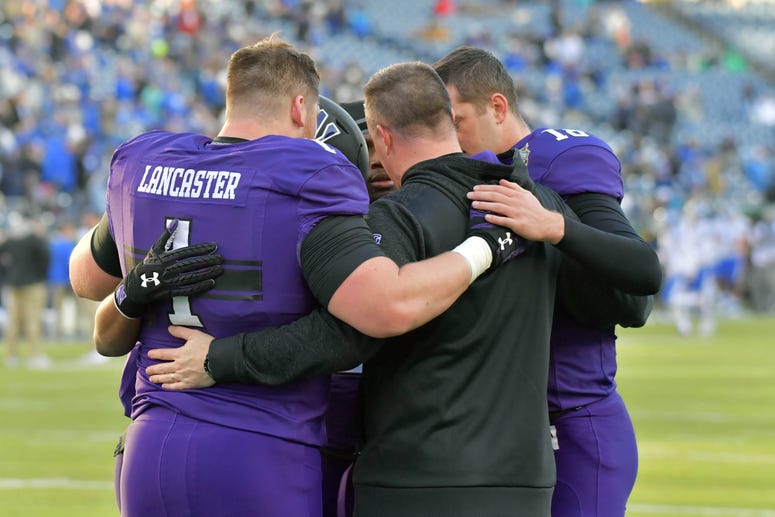 Northwestern Wildcats head coach Pat Fitzgerald talks with members of his team prior to the 2017 Franklin American Mortgage Music City Bowl against the Kentucky Wildcats at Nissan Stadium.