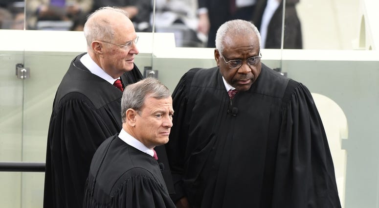 Chief Justice John Roberts, Supreme Court Justice Clarence Thomas and Supreme Court Justice Anthony Kennedy arrive ahead of the 2017 Presidential Inauguration at the U.S. Capitol.