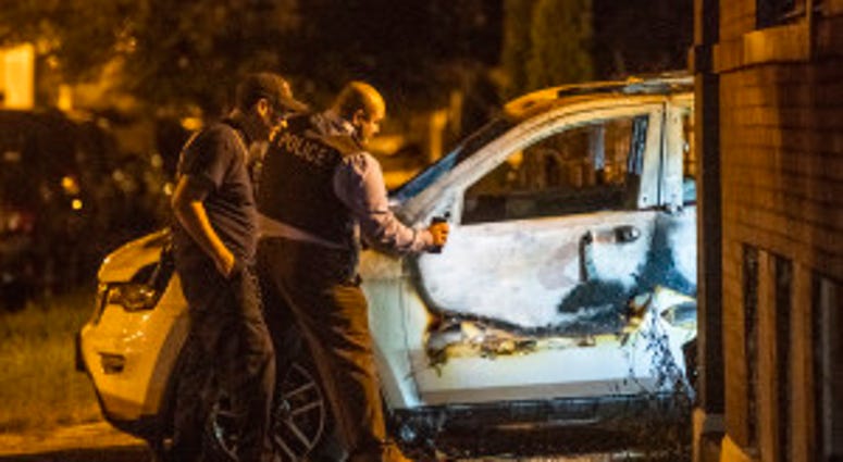 Police and Fire Department investigate a burned out vehicle that's related in a fatal shooting Sunday morning in the 4300 block of South Paulina. Police and Fire Department investigate a burned out vehicle that's related in a fatal shooting Sunday morning in the 4300 block of South Paulina.