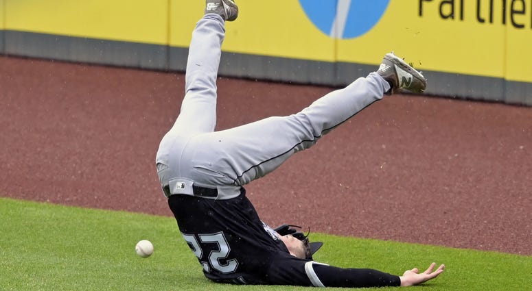 May 9, 2019; Cleveland, OH, USA; Chicago White Sox right fielder Charlie Tilson (22) loses his balance while reaching for a double by Cleveland Indians shortstop Francisco Lindor (not pictured) in the fifth inning at Progressive Field. May 9, 2019; Cleveland, OH, USA; Chicago White Sox right fielder Charlie Tilson (22) loses his balance while reaching for a double by Cleveland Indians shortstop Francisco Lindor (not pictured) in the fifth inning at Progressive Field.