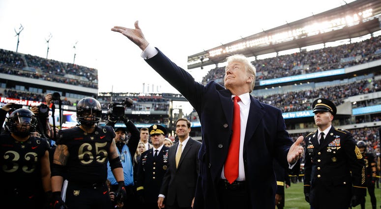 President Donald Trump tosses the coin before the Army-Navy NCAA college football game Saturday, Dec. 8, 2018 President Donald Trump tosses the coin before the Army-Navy NCAA college football game Saturday, Dec. 8, 2018