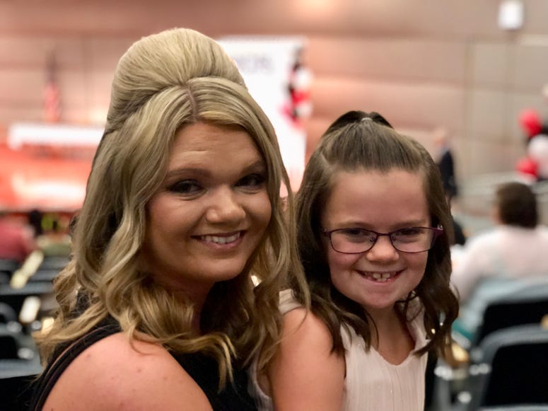Karen Cook and her daughter Braylynn attend the DCFS scholarship ceremony Friday, July 27, at the Thompson Center. Karen Cook and her daughter Braylynn attend the DCFS scholarship ceremony Friday, July 27, at the Thompson Center.