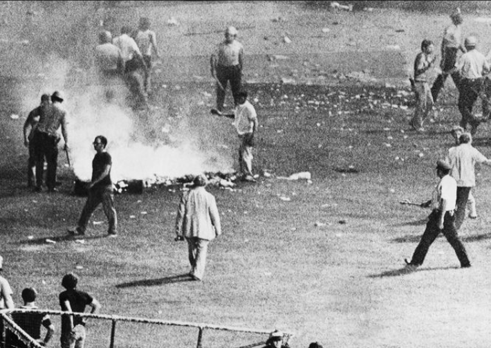Chicago police disperse the crowd in center field at Comiskey Park after hundreds of disco records were blown up. Chicago police disperse the crowd in center field at Comiskey Park after hundreds of disco records were blown up.