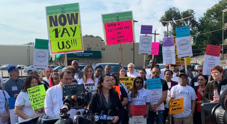 Current and former employees of Chicago's Treasure Island foods rallied outside its Lakeview store today to call on the company to pay for lost wages and insurance after its sudden closing.