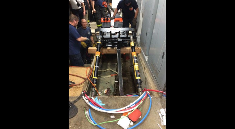 Chicago fire officials work to remove the forklift that injured a 51-year-old man Sept. 30, 2019 from a hole at the Museum of Science and Industry Chicago fire officials work to remove the forklift that injured a 51-year-old man Sept. 30, 2019 from a hole at the Museum of Science and Industry