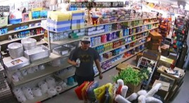 Surveillance footage shows a man police believe robbed two stores in Little Village.