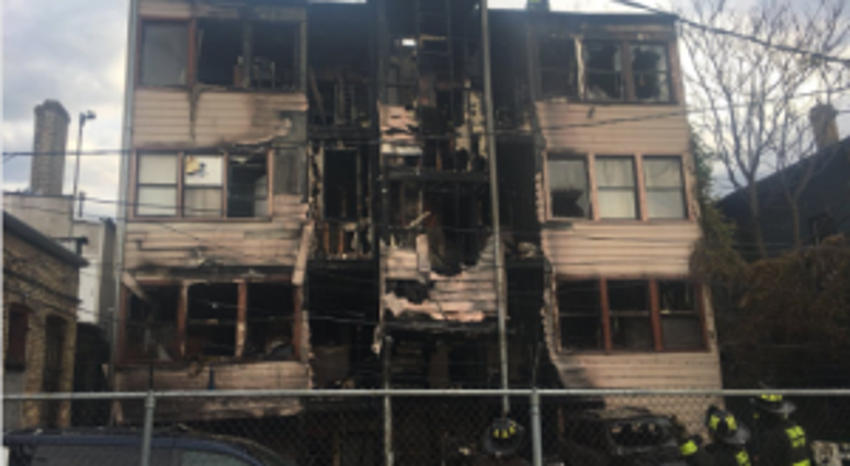 Investigators suspect arson was the cause of a fire early Tuesday in Rogers Park that led to a woman's death.
