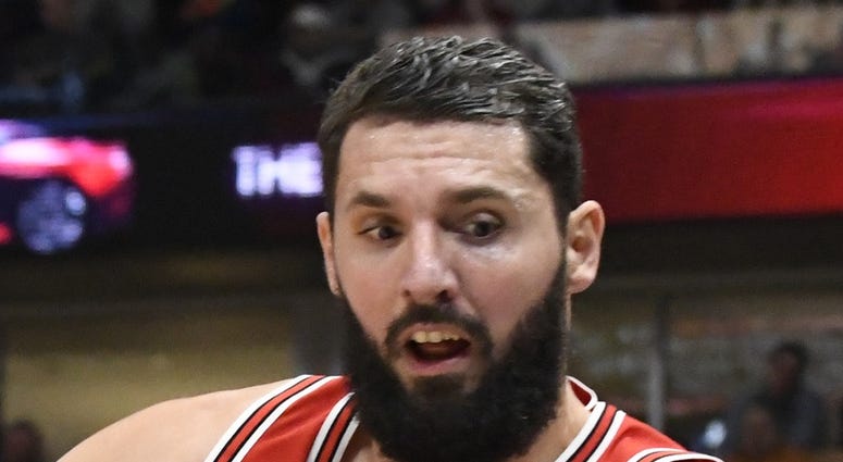 Chicago Bulls forward Nikola Mirotic (44) saves the ball from going out of bounds against the Miami Heat during the second half at United Center.
