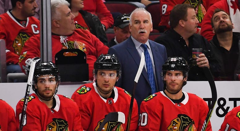 Chicago Blackhawks head coach Joel Quenneville looks on from the bench during a game against the Calgary Flames at the United Center. The Flames won 3-2.