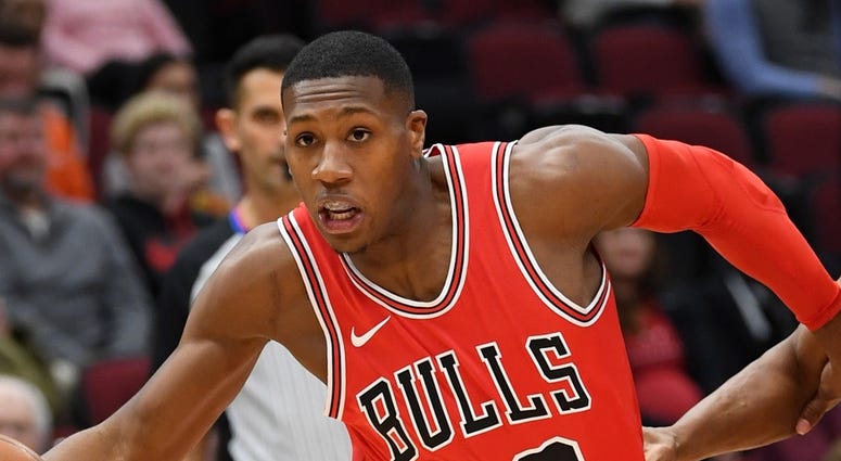 Chicago Bulls guard Kris Dunn (32) drives against Toronto Raptors guard Kyle Lowry (7) during the first half at United Center. Raptors won 122-98.