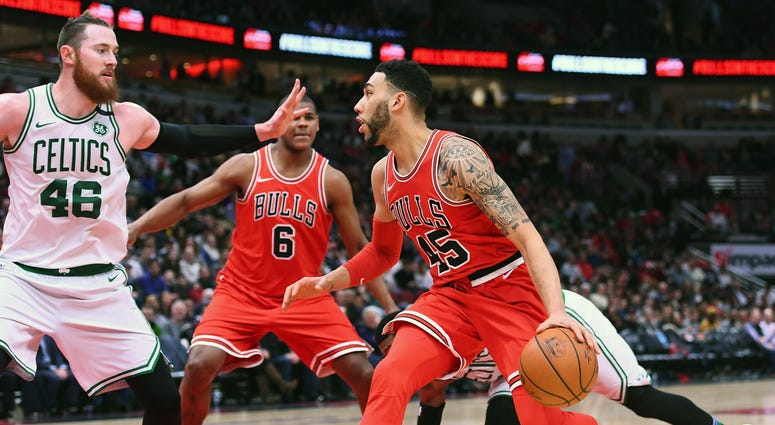 Mar 5, 2018; Chicago, IL, USA; Chicago Bulls forward Denzel Valentine (45) dribble the ball against Boston Celtics center Aron Baynes (46) during the second half at the United Center.
