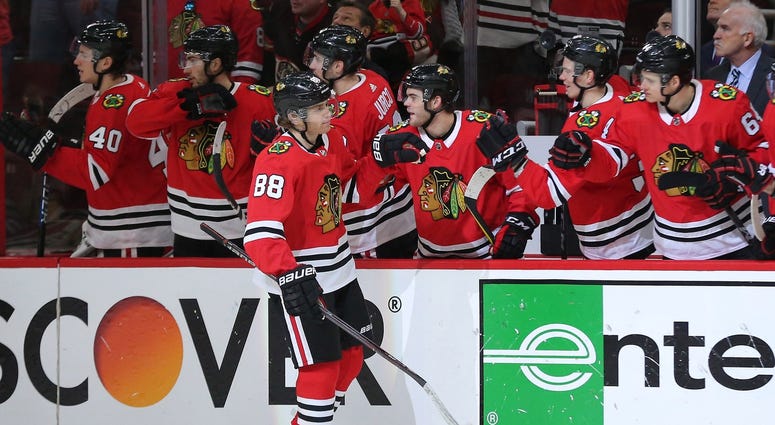 Mar 11, 2018; Chicago, IL, USA; Chicago Blackhawks right wing Patrick Kane (88) is congratulated for scoring a goal during the third period against the Boston Bruins at the United Center. Chicago won 3-1.
